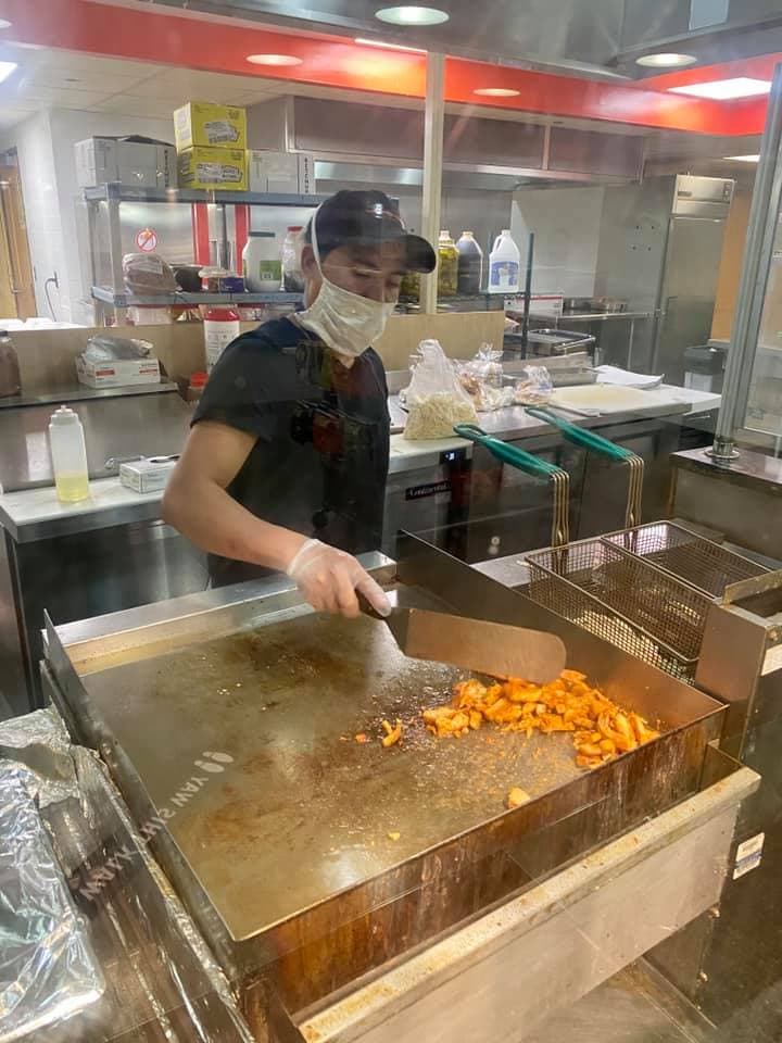 Basma's Kitchen staff preparing fresh Mediterranean food with care and attention